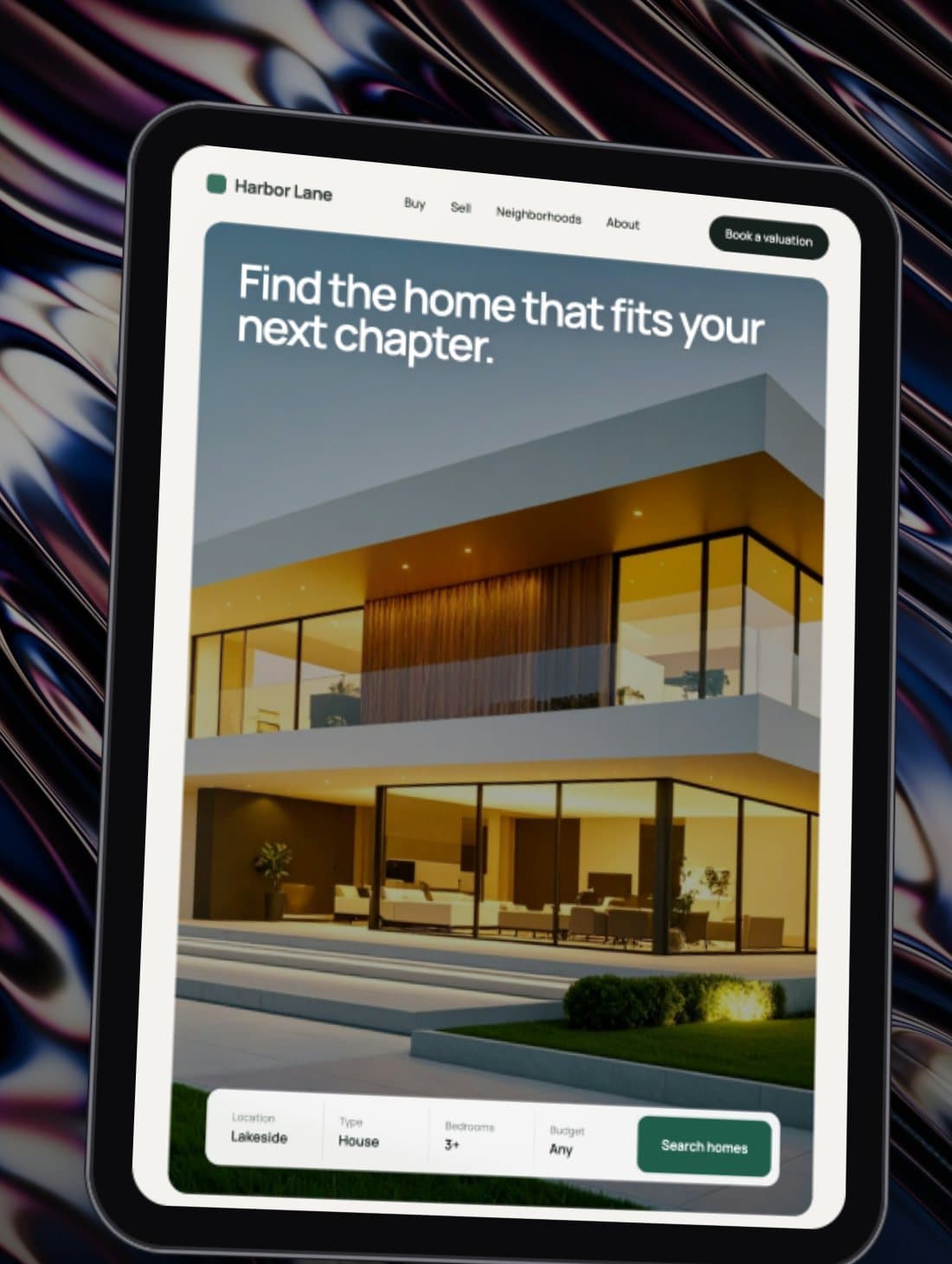 Concept real-estate website shown on a tablet over an iridescent background